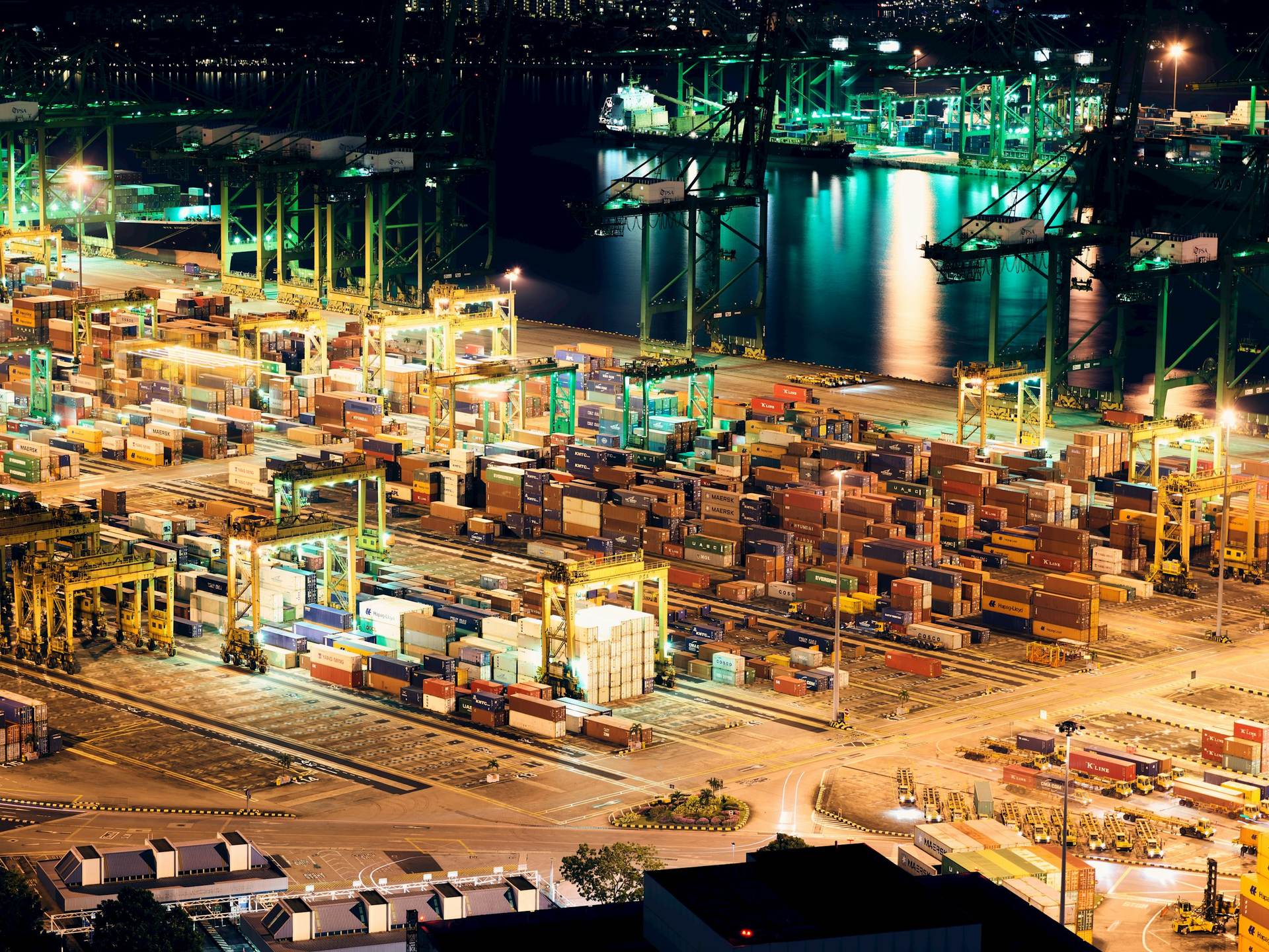 Port terminal operating through the night, reflecting continuous 24/7 marine operations